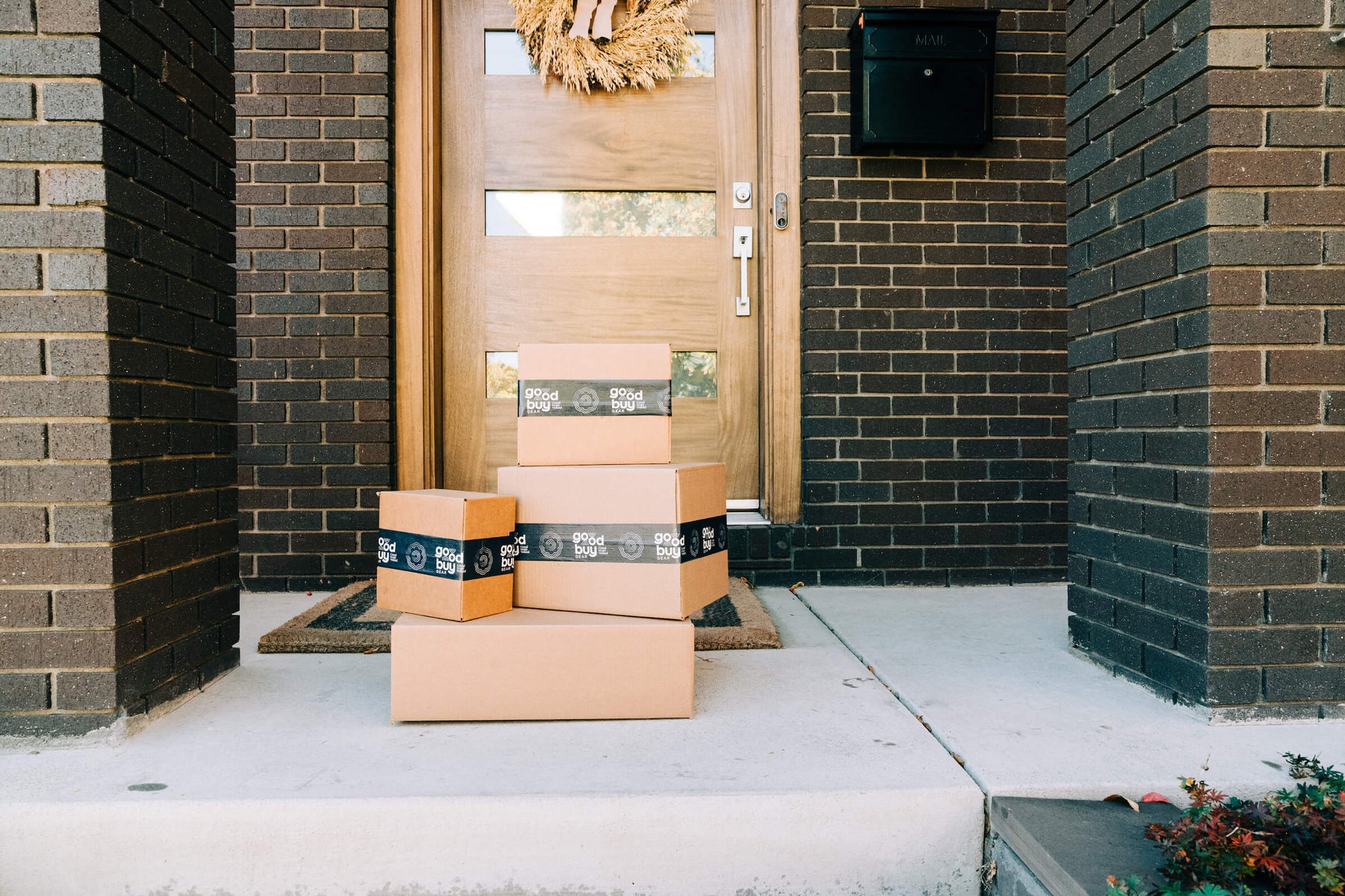 Goodbuy Gear Christmas packages on a doorstep