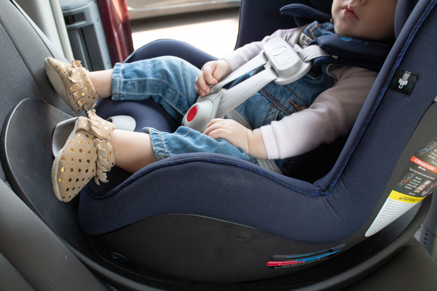 baby in a rear-facing car seat