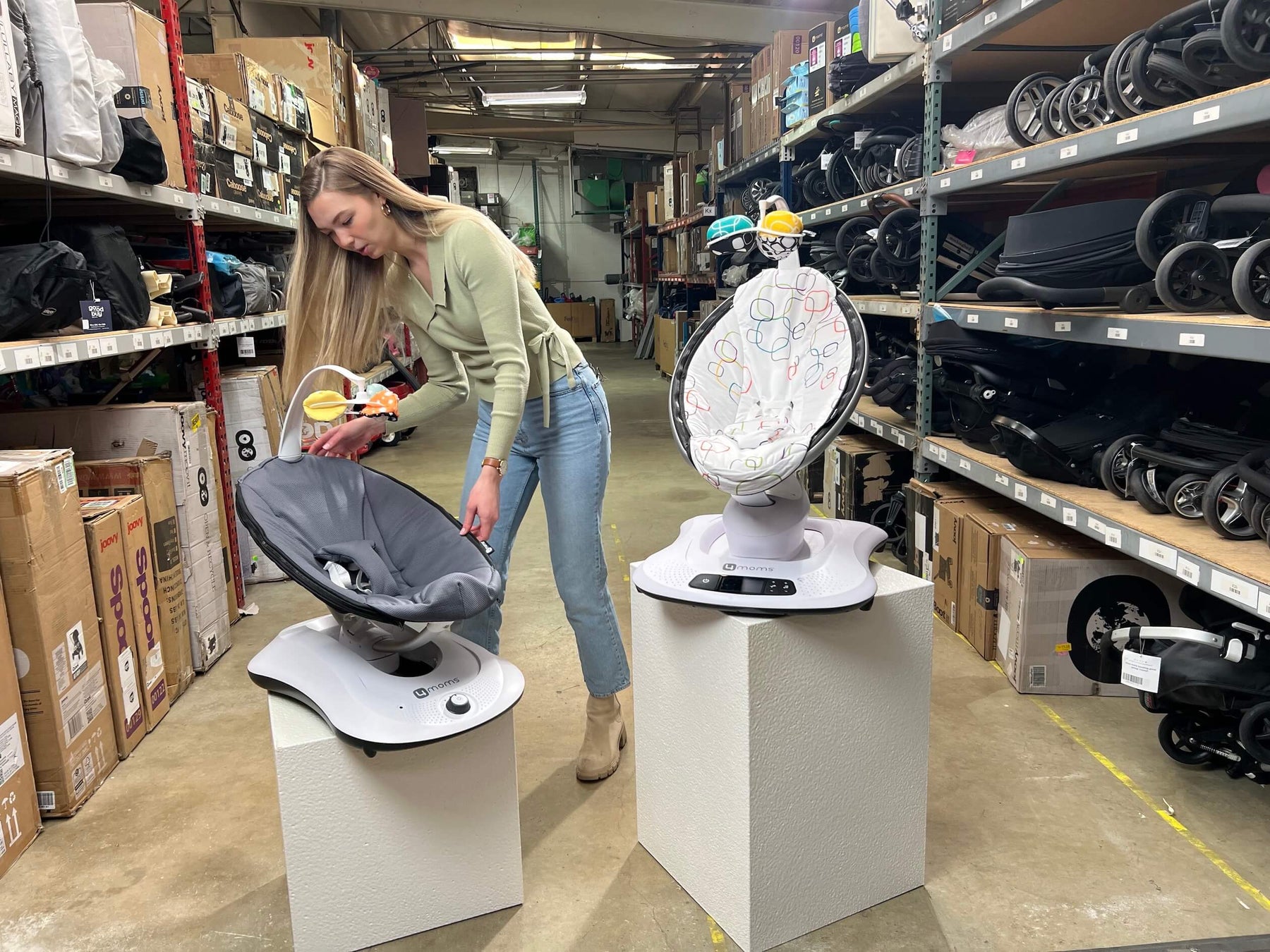 Our gear expert standing next to the MamaRoo and RockaRoo