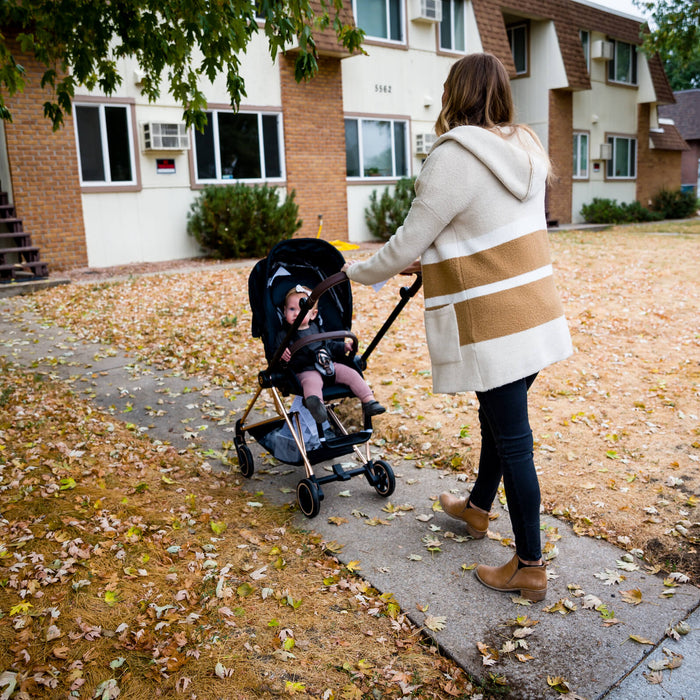 mom walking her baby with a used stroller