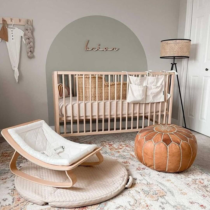 Neutral nursery with a wooden crib