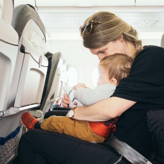 Mom on a plane with her toddler 