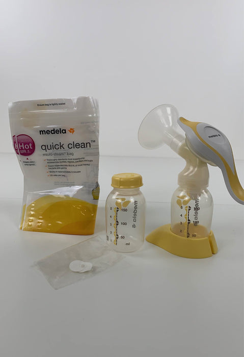 used Medela Harmony Manual Breast Pump, w/ 2 Micro Steam Bags