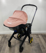 used Doona Infant Car Seat & Stroller Combo, Blush Pink, 2022